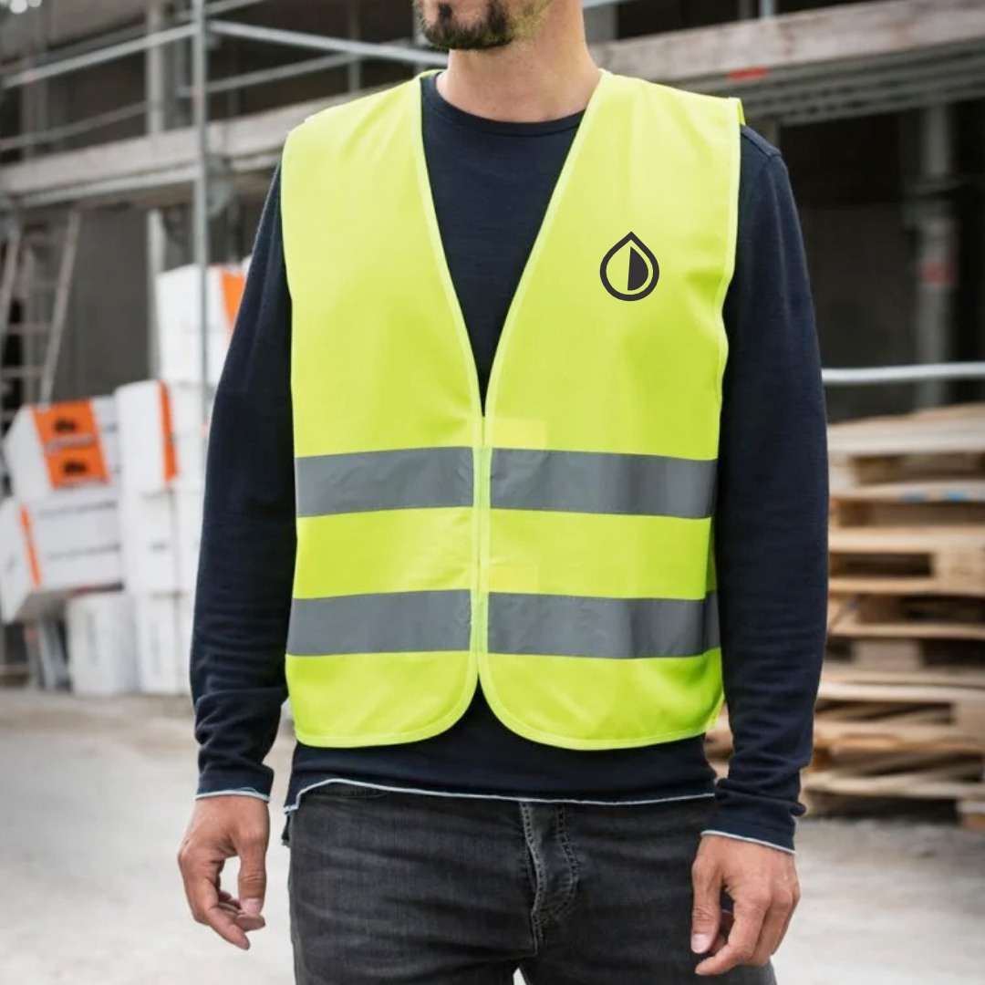 Custom safety accessories including reflective vests, helmets, armbands, and PPE items printed with logos for workplaces and events in Dubai.