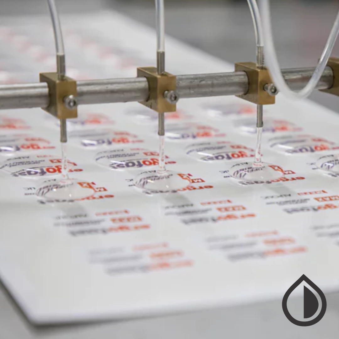 Custom epoxy doming services in Dubai for high-gloss, durable labels, logos, and promotional items with a 3D resin finish for a premium look.