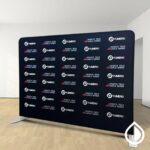 Custom printed backdrops for events, trade shows, and branding in Dubai. High-quality fabric, vinyl, and mesh options with vibrant full-color prints.