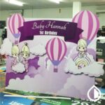 Custom printed backdrops for events, trade shows, and branding in Dubai. High-quality fabric, vinyl, and mesh options with vibrant full-color prints.