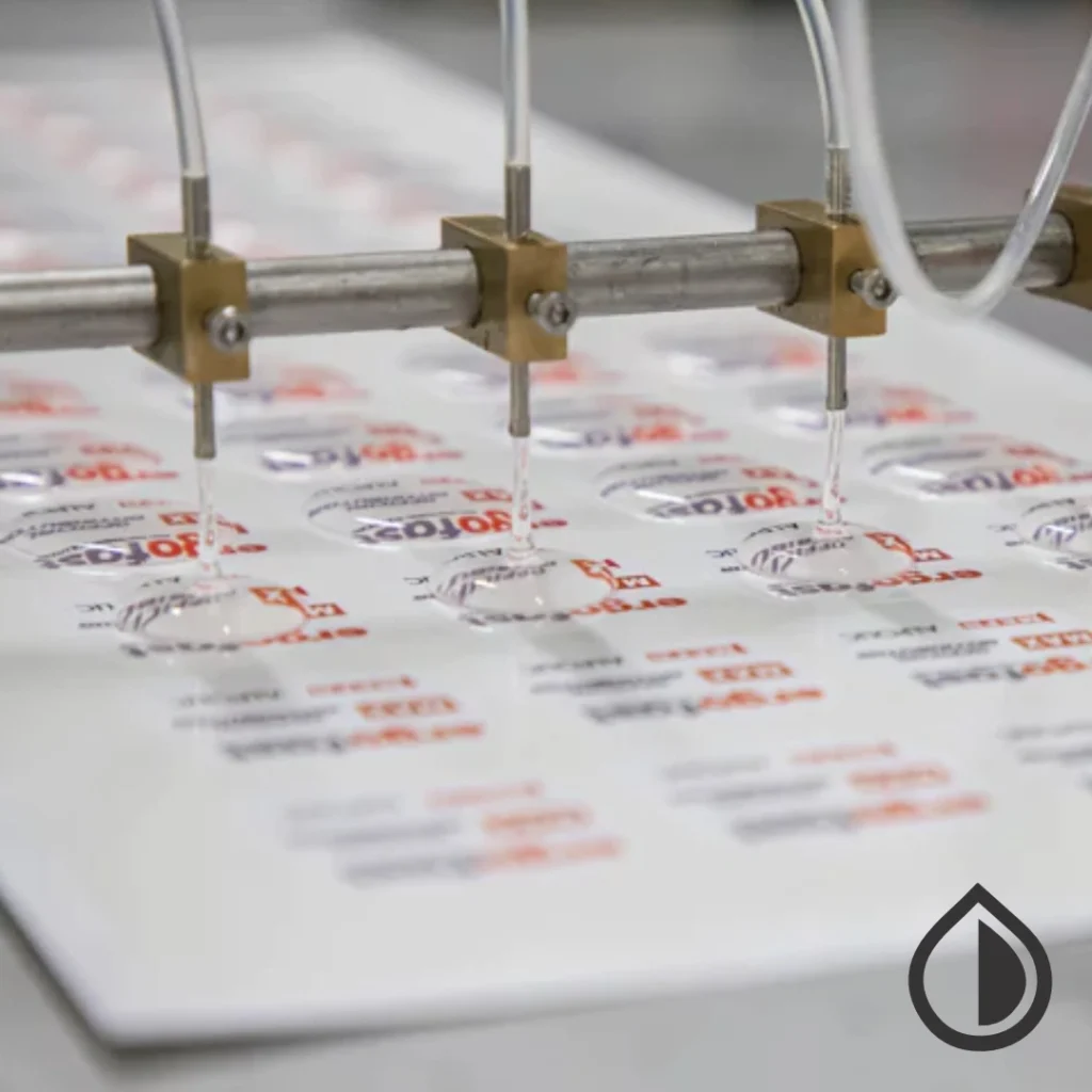 Custom epoxy doming for badges, labels, and promotional items with durable 3D resin finish