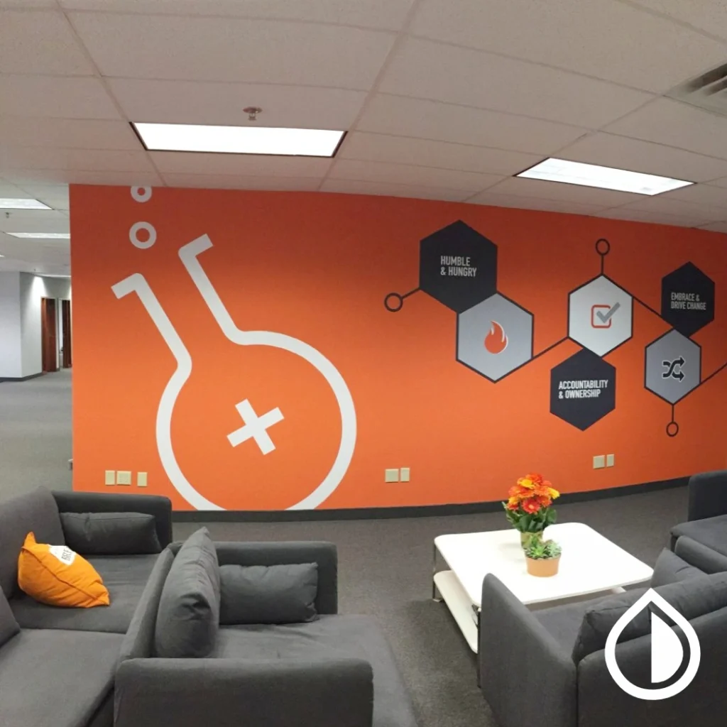 Large-format wall branding with high-quality vinyl, graphics installation, and corporate interior branding in Dubai